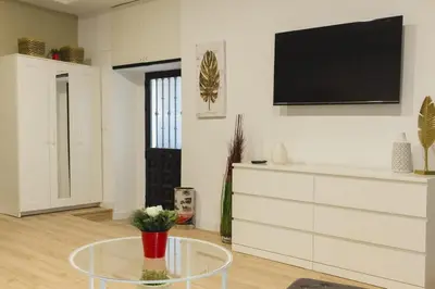 Una televisión o centro de entretenimiento en Alojamiento central
