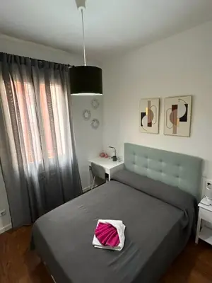 Cama o camas de una habitación en Habitaciones Magdalena