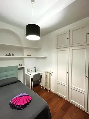 Cama o camas de una habitación en Habitaciones Magdalena