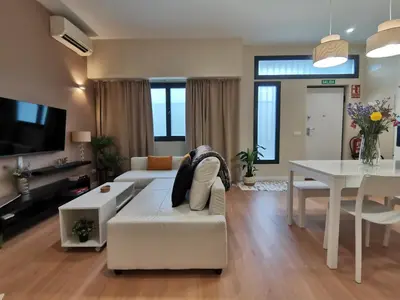Una televisión o centro de entretenimiento en Apartamento de Lujo - A 10 minutos del centro