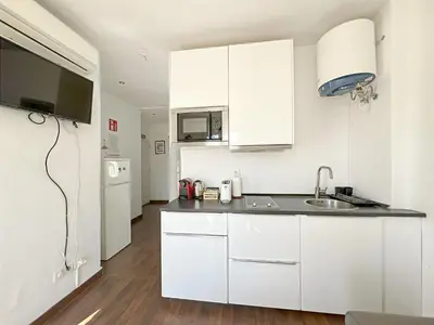Una cocina o zona de cocina en Ático con Terraza en Madrid