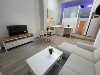 Una televisión o centro de entretenimiento en Apartamento moderno céntrico