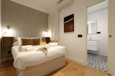 Cama o camas de una habitación en Madrid Río Suites