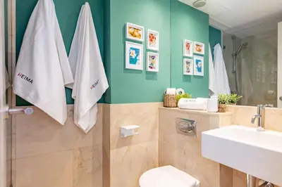 Un baño de Heima Penthouse City Center