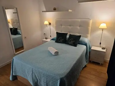 Cama o camas de una habitación en Apartamento Gran Via Madrid W8.1