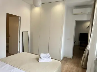 Cama o camas de una habitación en Moderno apartamento en pleno centro