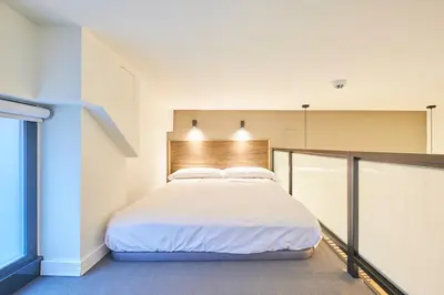 Cama o camas de una habitación en Madrid Urban Comfort