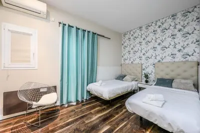 Cama o camas de una habitación en Luxury Apartment in Puerta del Sol Madrid