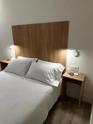 Cama o camas de una habitación en Apartamentos Moncloa