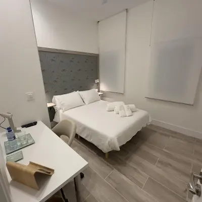 Cama o camas de una habitación en Apartamentos Moncloa