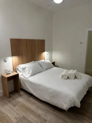 Cama o camas de una habitación en Apartamentos Moncloa