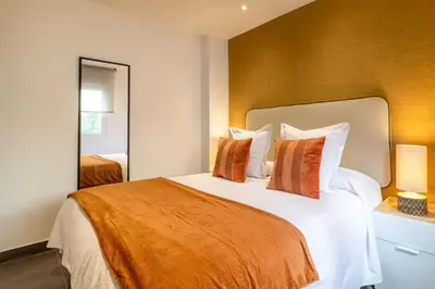 Cama o camas de una habitación en Modern 1-Bed Apartment with Private Terrace