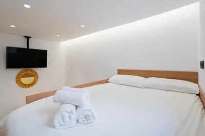 Cama o camas de una habitación en Chueca Hortaleza 12Pax 5 Bedrooms 5 Baths