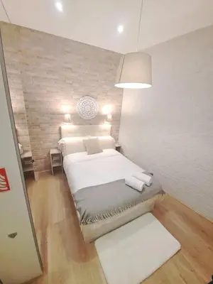 Cama o camas de una habitación en Cosy apartamento en La Latina