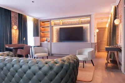 Una televisión o centro de entretenimiento en Casa Faraona Luxury Residences
