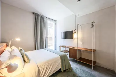 Cama o camas de una habitación en Arteria Madrid Latina