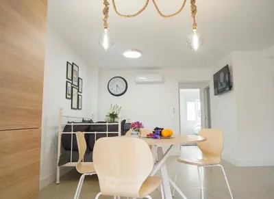 Una televisión o centro de entretenimiento en Apartamento Ágüelos