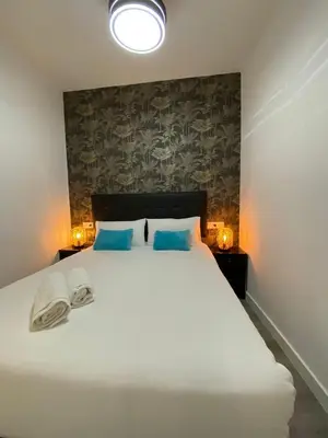 Cama o camas de una habitación en Gran Vía Urban Apartments