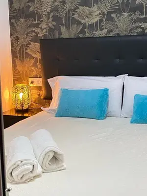 Cama o camas de una habitación en Gran Vía Urban Apartments