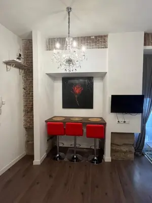 Una televisión o centro de entretenimiento en Gran Vía Urban Apartments