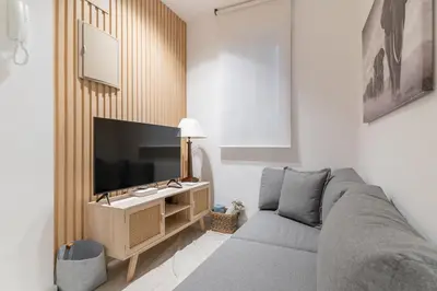 Una televisión o centro de entretenimiento en Modern and cozy-1Bedroom 1Bathroom-Azca