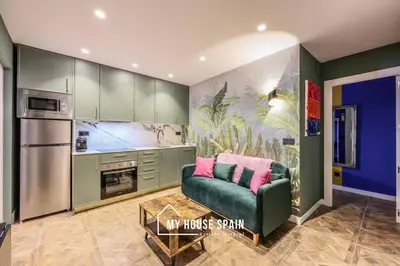 Una cocina o zona de cocina en MyHouseSpain - Moderno piso junto a Gran Vía