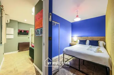 Cama o camas de una habitación en MyHouseSpain - Moderno piso junto a Gran Vía