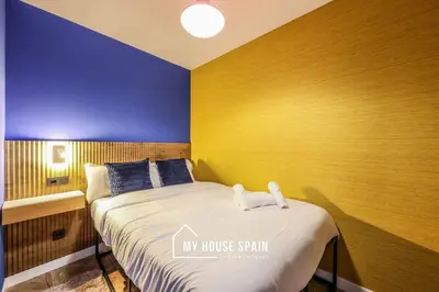 Cama o camas de una habitación en MyHouseSpain - Moderno piso junto a Gran Vía