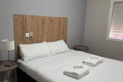 Cama o camas de una habitación en Meta Habitat Ramon Lujan A