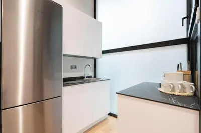 Una cocina o zona de cocina en Urban Loft near Atocha (Ercilla N)