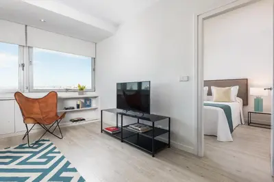 Una televisión o centro de entretenimiento en Homeclub Apartment at Plaza Colon XXIII
