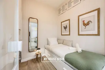 Cama o camas de una habitación en MyHouseSpain - Nuevo piso reformado en Malasaña