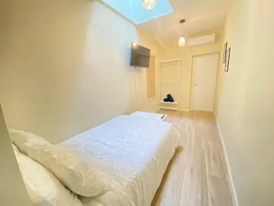 Cama o camas de una habitación en ESTUDIOS GRAN VÍA