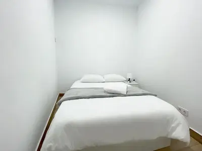 Cama o camas de una habitación en Cerca del centro y luminoso