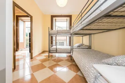 Cama o camas de una habitación en Grand Latina Apartment