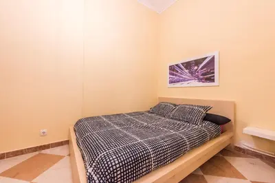 Cama o camas de una habitación en Grand Latina Apartment