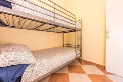 Cama o camas de una habitación en Grand Latina Apartment