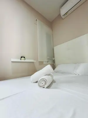 Cama o camas de una habitación en Acogedor apartamento en Atocha by beBalmy