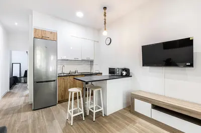 Una cocina o zona de cocina en Apartamentos a 5 minutos del centro de Madrid 4P