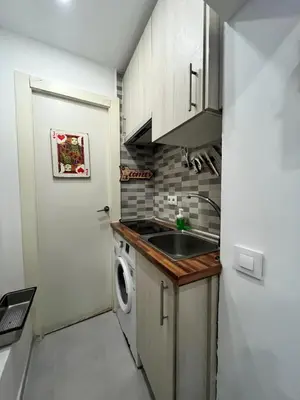 Una cocina o zona de cocina en Acogedor Ile madrid Baba olivar Temporal