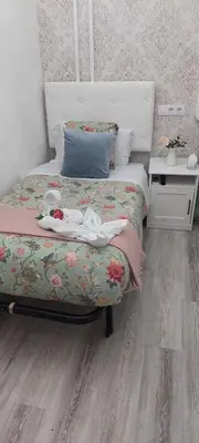 Cama o camas de una habitación en Hostal Milan