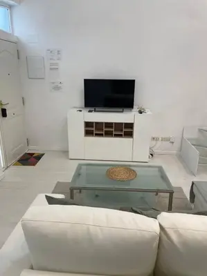 Una televisión o centro de entretenimiento en Loft en Retiro