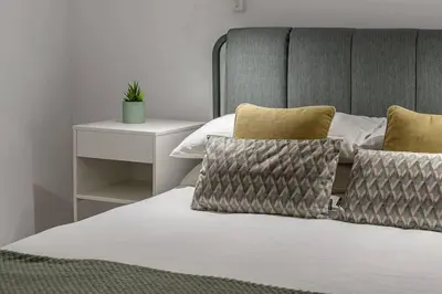 Cama o camas de una habitación en ¡Estilo y luz en Hermosilla!