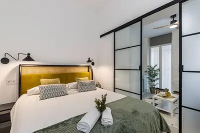 Cama o camas de una habitación en ¡Estilo y luz en Hermosilla!