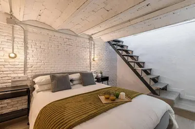 Cama o camas de una habitación en ¡Estilo y luz en Hermosilla!