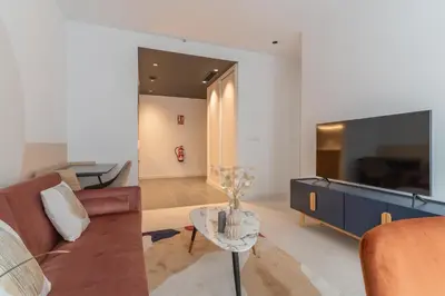 Una televisión o centro de entretenimiento en Canillas Apartments