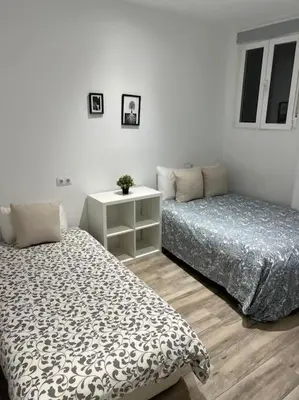 Cama o camas de una habitación en Apartamento Acogedor Carpetana