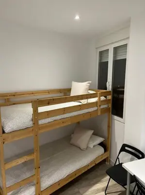 Cama o camas de una habitación en Apartamento Acogedor Carpetana