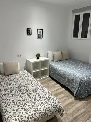 Cama o camas de una habitación en Apartamento Acogedor Carpetana