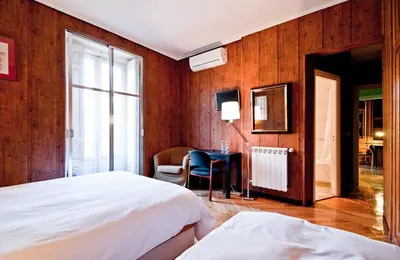 Cama o camas de una habitación en Hostal Asunción
